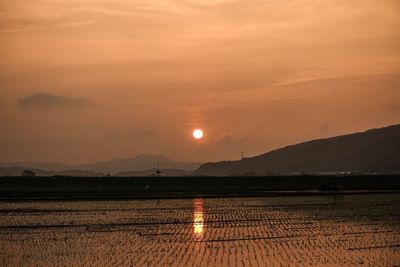 Scenic view of mountains at sunset