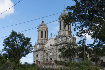 Low angle view of bell tower against sky