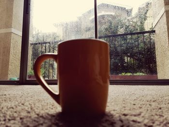 Close-up of coffee cup on table