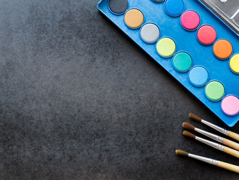 High angle view of multi colored pencils on shelf