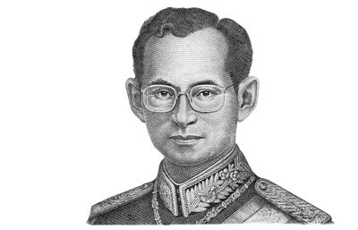 Close-up portrait of young man against white background