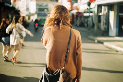 Rear view of woman walking in the city