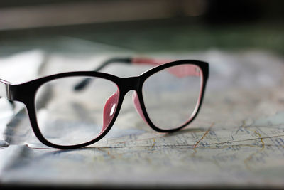 Close-up of eyeglasses on map