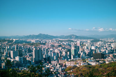 Aerial view of cityscape against clear sky