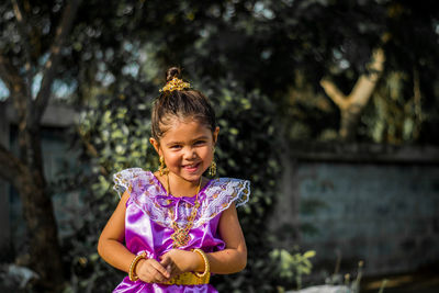 Portrait of girl holding flower