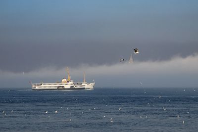 Ship in sea against sky