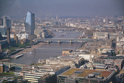 High angle view of river amidst buildings in city