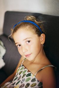 Portrait of girl sitting at home