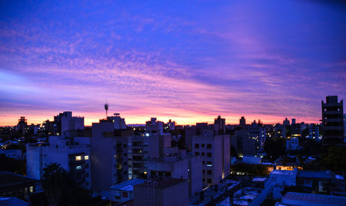 Cityscape against sky during sunset