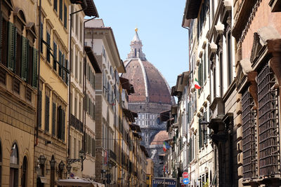 Low angle view of buildings against clear sky