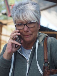 Portrait of mature woman talking on mobile phone