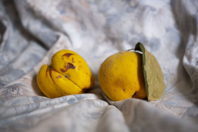 Close-up of yellow fruits on bed