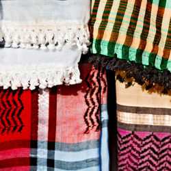 Close-up of multi colored umbrellas hanging at market stall