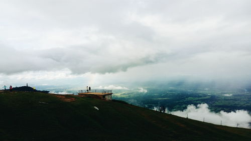 Scenic view of landscape against cloudy sky