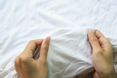 Midsection of man lying on bed