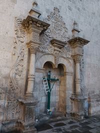 Low angle view of cross on building