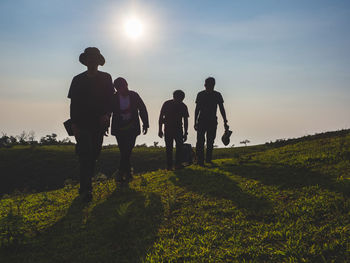 Group of men backpackers are happy and joyful after successful hiking.