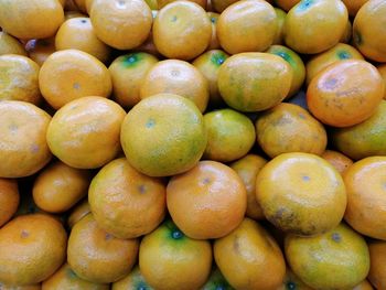 Full frame shot of oranges at market stall