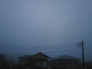 Low angle view of house against sky at dusk