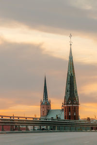 Low angle view of buildings against sky during sunset