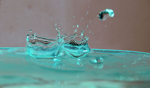 Close-up of water splashing in glass