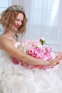 Woman holding flower bouquet