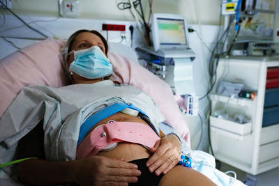 High angle view of doctor examining patient at clinic