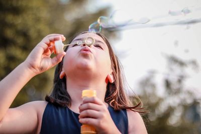 Midsection of woman holding ice cream