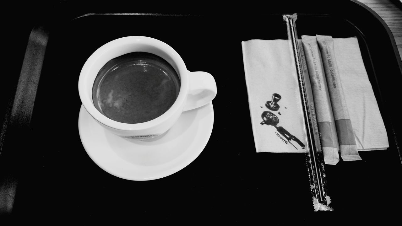 coffee cup, drink, indoors, food and drink, refreshment, coffee - drink, table, still life, saucer, coffee, cup, high angle view, freshness, directly above, close-up, no people, spoon, beverage, day, plate