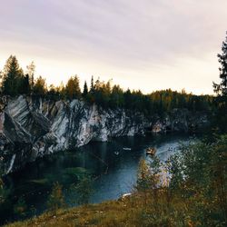 Scenic view of lake against sky at sunset