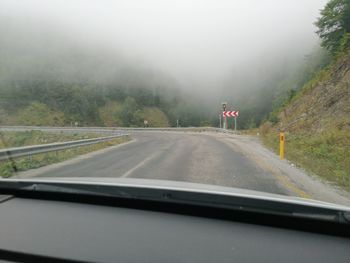 Road seen through car windshield