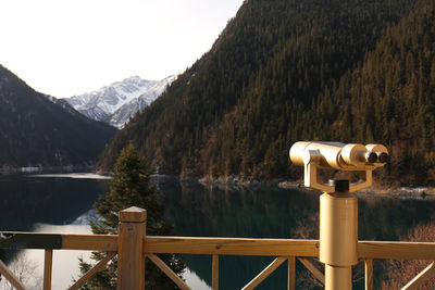 Close-up of binoculars against mountain