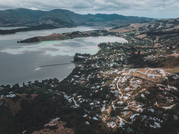 High angle view of townscape and mountains against sky