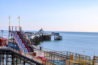 Pier over sea against sky