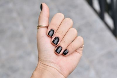 Close-up of woman hand on finger