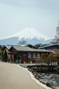 Scenic view of snow covered mountains against sky