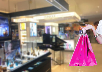 Close-up of pink clothes hanging in store