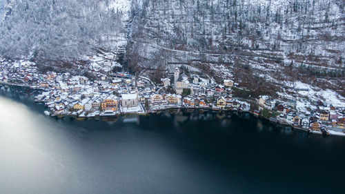 Aerial view of river amidst buildings in city