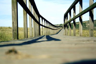 Surface level of bridge against sky