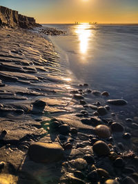 Scenic view of sea against sky during sunset