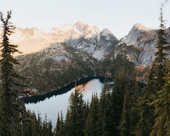 Scenic view of lake and mountains against clear sky