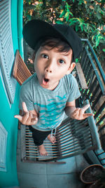 High angle portrait of cute boy standing outdoors