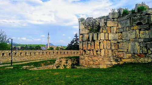 View of old ruin building against cloudy sky