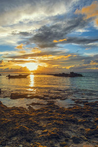 Scenic view of sea against sky during sunset
