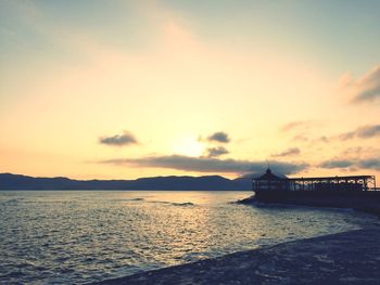 Scenic view of sea against cloudy sky