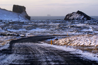 Scenic view of sea during winter against sky