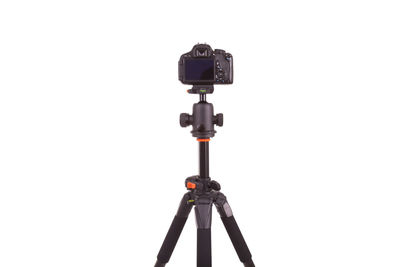 Low angle view of camera against white background