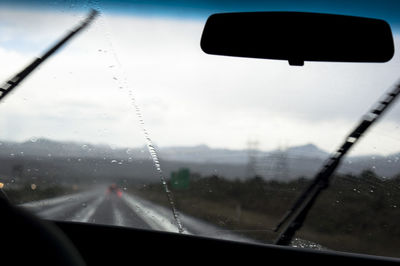 Close-up of car on road