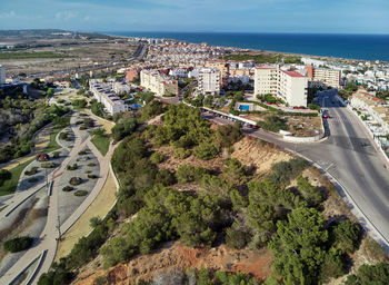 High angle view of road by cityscape