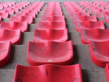 Full frame shot of red seats arranged in stadium